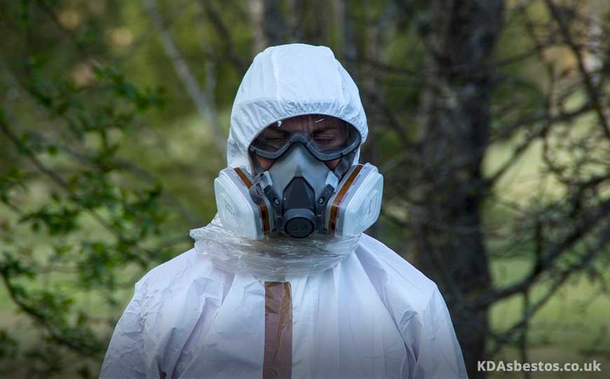 Man Wearing Hazmat Suit & Gas Mask