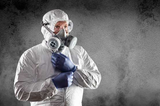 Asbestos Surveyor Wearing Hazmat Suit